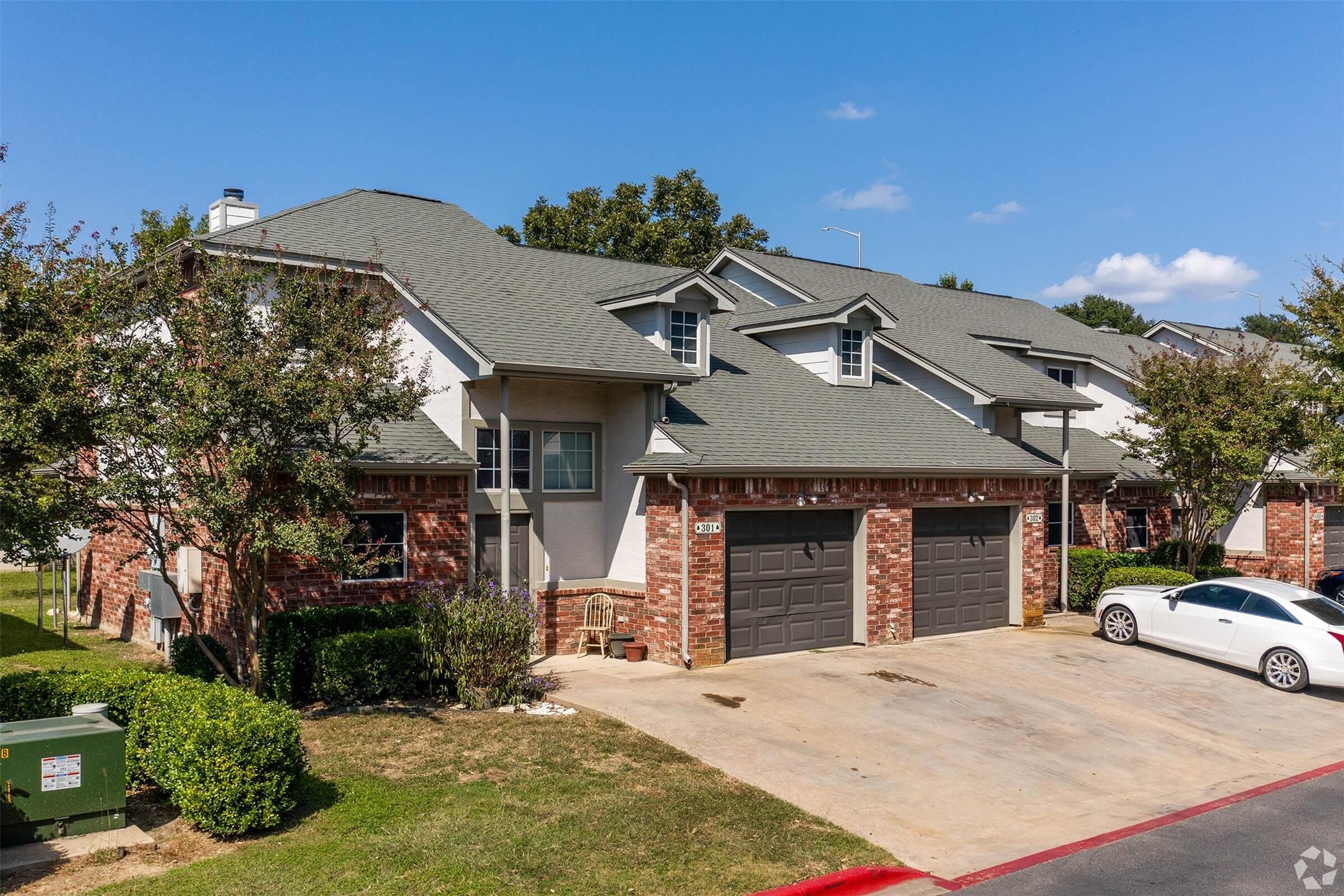 400 East Cypress Creek Road Cedar Park, TX 78613 - Photo 4 of 12 a front view of a house with a yard and garage
