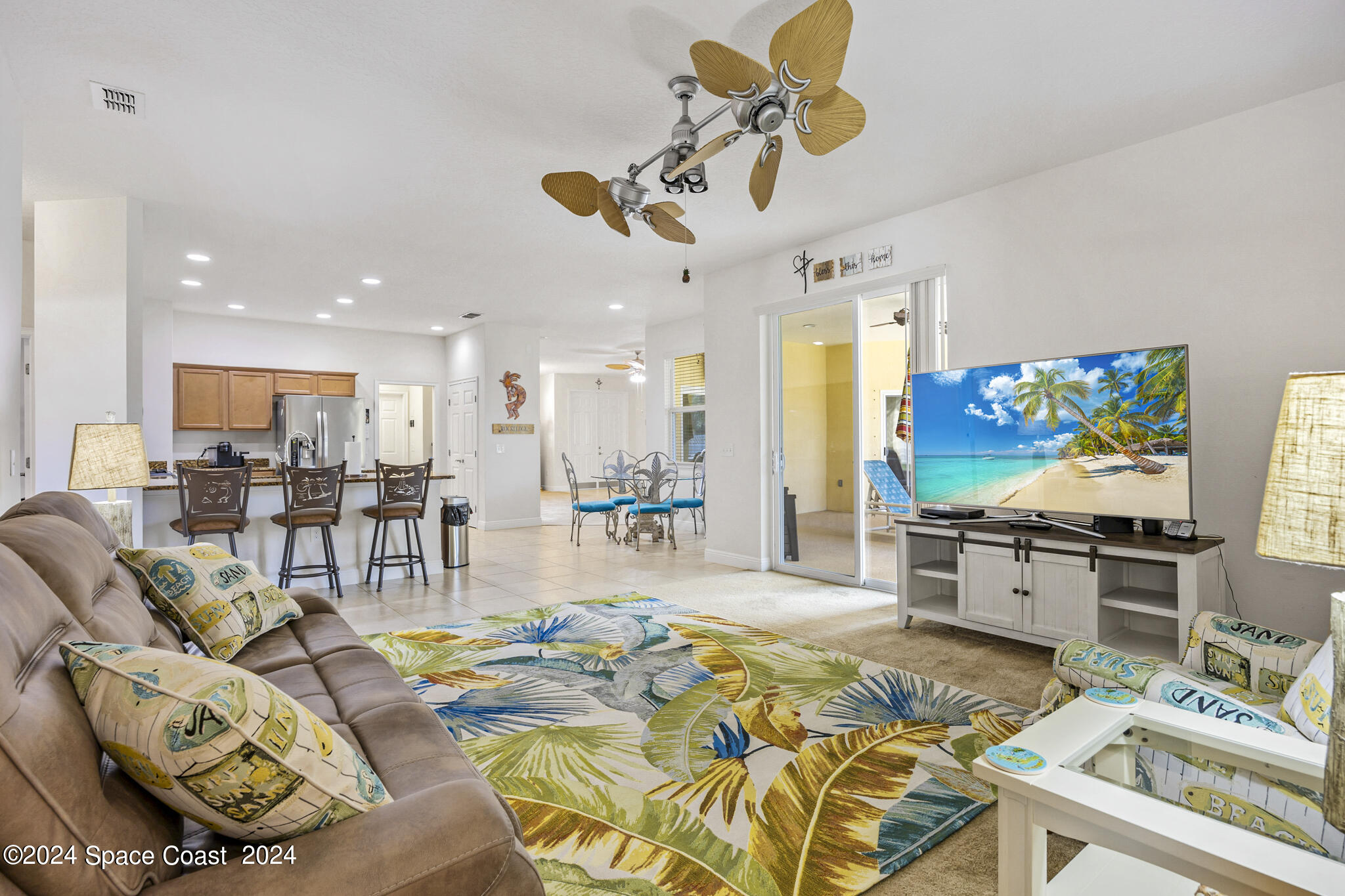 572 Glenbrook Circle Rockledge, FL 32955 - Photo 17 of 35 a living room with stainless steel appliances kitchen island granite countertop furniture and a dining table