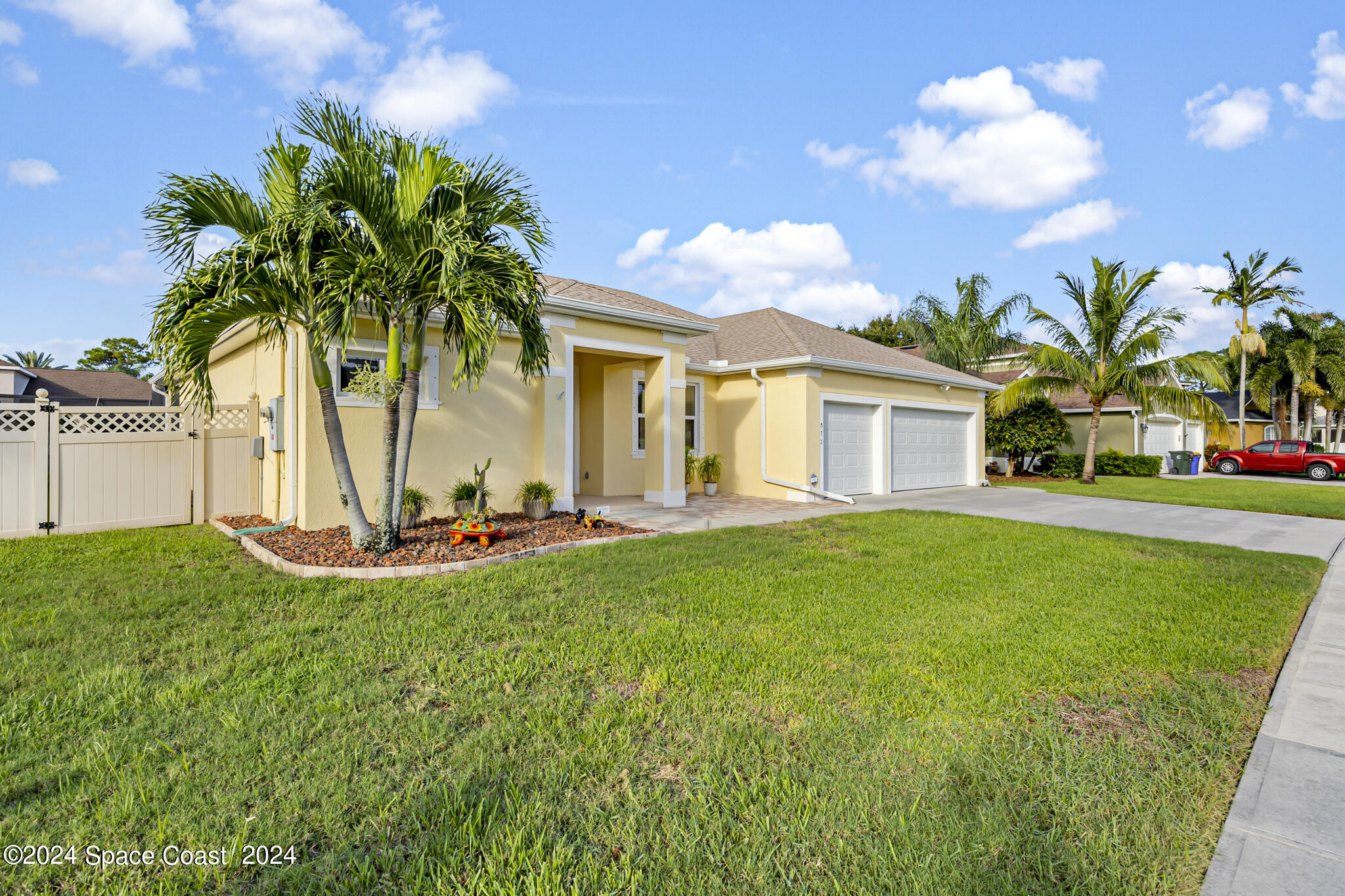 572 Glenbrook Circle Rockledge, FL 32955 - Photo 2 of 35 a view of a house with backyard and a tree