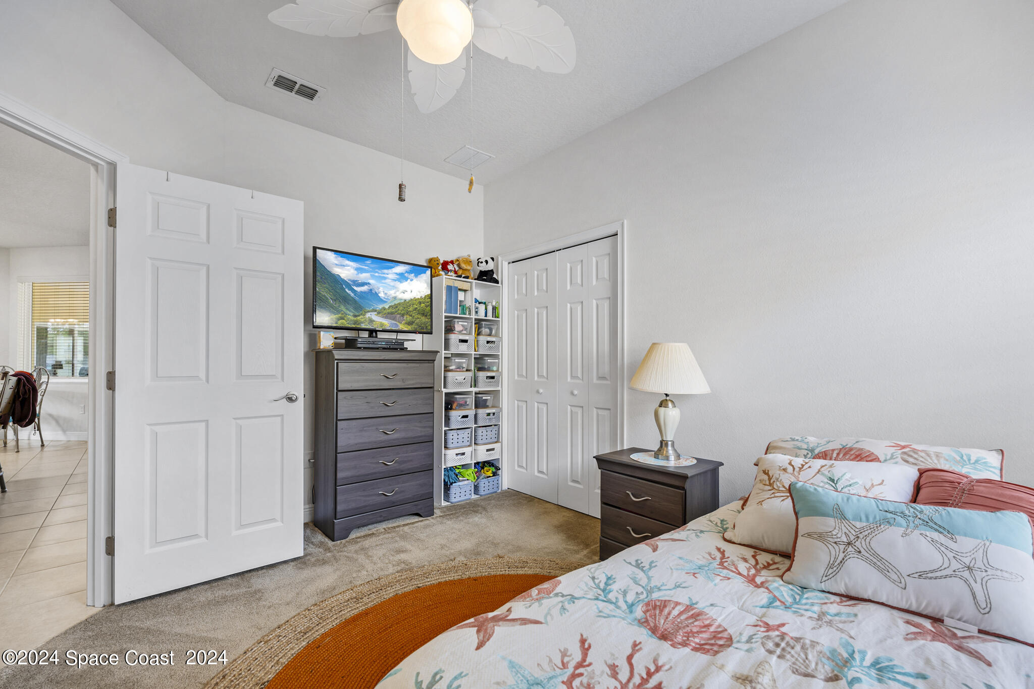572 Glenbrook Circle Rockledge, FL 32955 - Photo 27 of 35 a bedroom with a bed and a closet