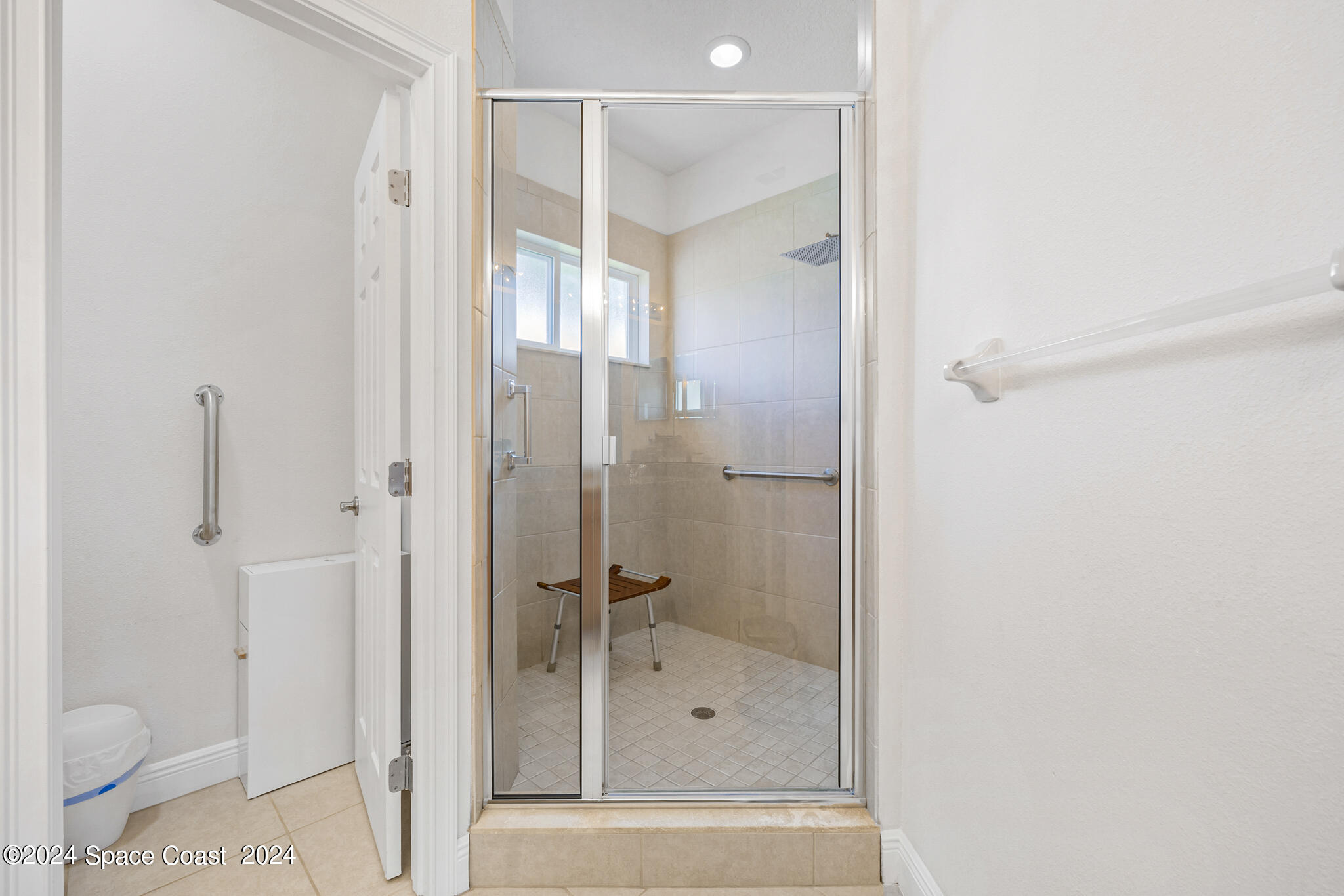 572 Glenbrook Circle Rockledge, FL 32955 - Photo 29 of 35 a bathroom with a shower and a toilet