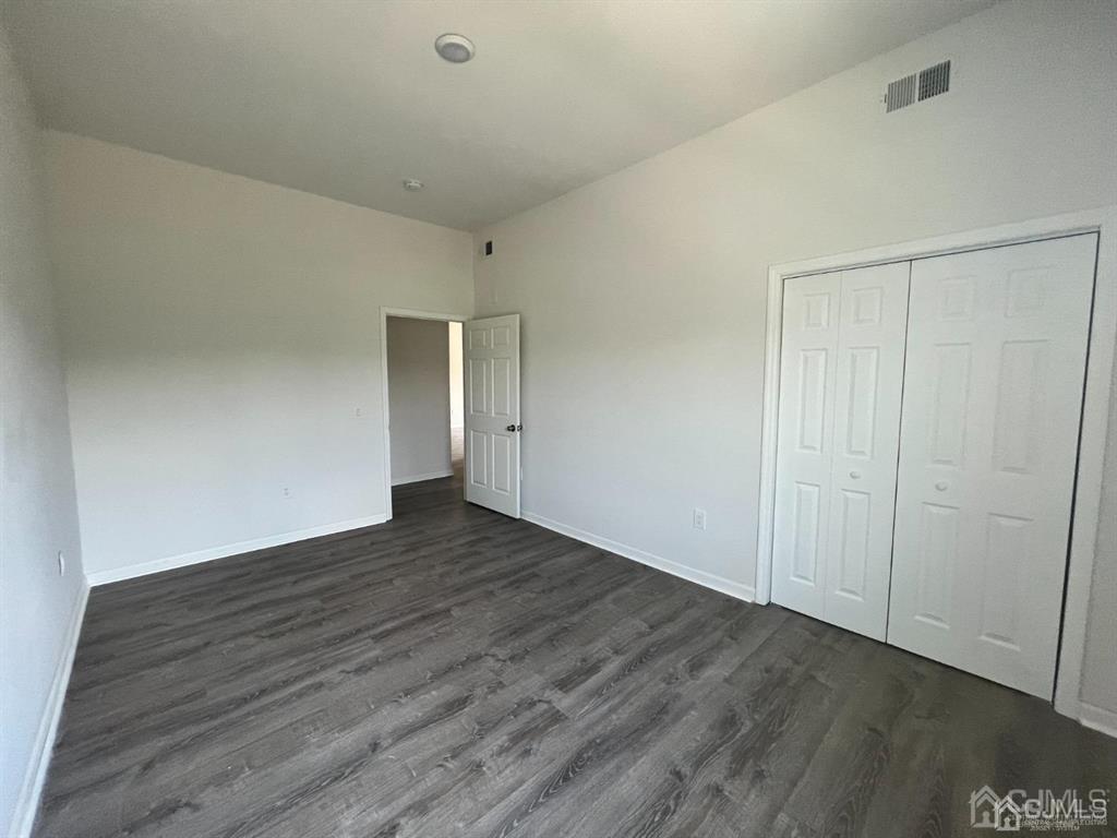 37 Old Trenton Road, Unit 17 Cranbury, NJ 08512 - Photo 7 of 11 a view of an empty room with wooden floor