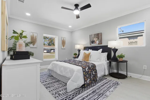 a room with a bed and a chandelier