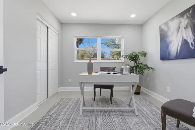 a view of a workspace with furniture