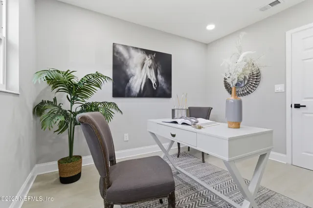 a view of a workspace with furniture