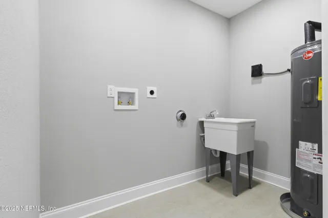 a view of a house with backyard and a tree