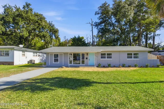 front view of a house with a yard