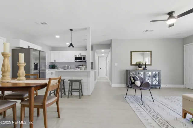 a view of a dining room with furniture