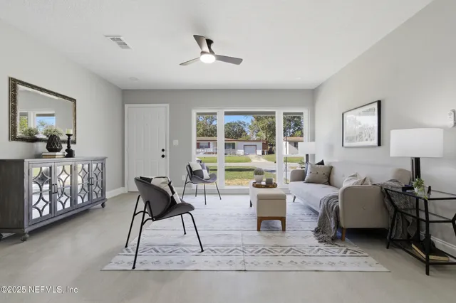 a living room with furniture and a rug