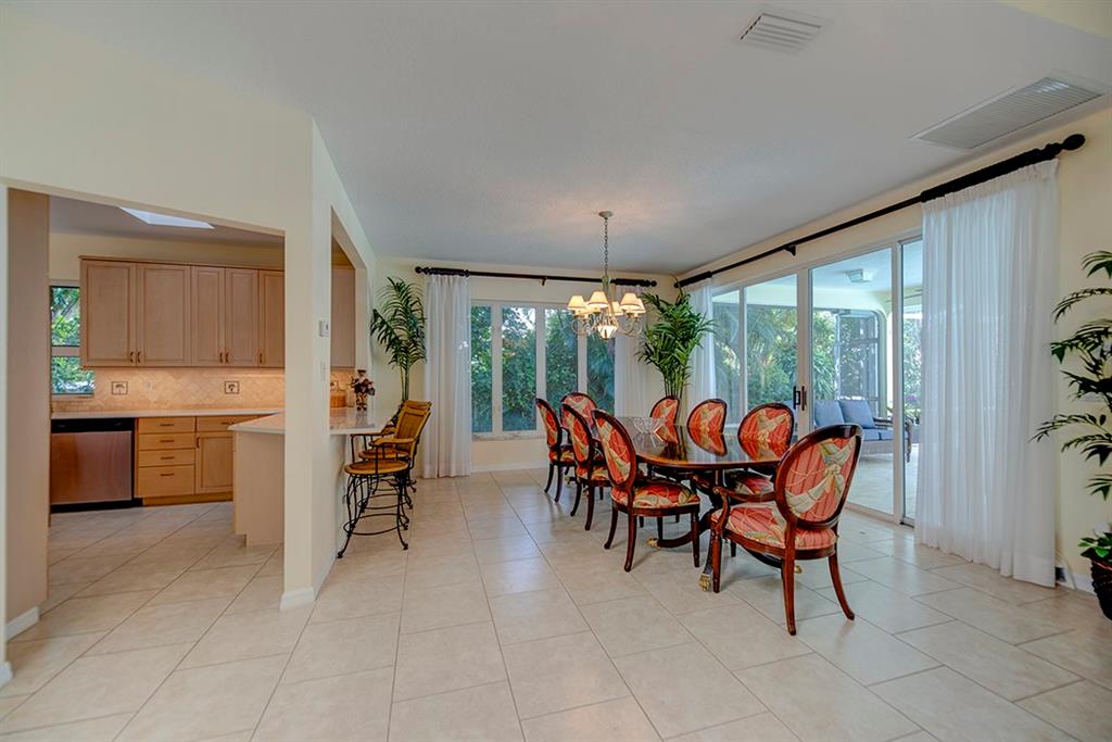 107 South Sewalls Point Road Stuart, FL 34996 - Photo 19 of 57 a dining room with furniture and a floor to ceiling window