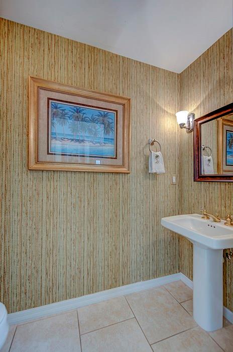 107 South Sewalls Point Road Stuart, FL 34996 - Photo 23 of 57 a bathroom with a sink and a mirror