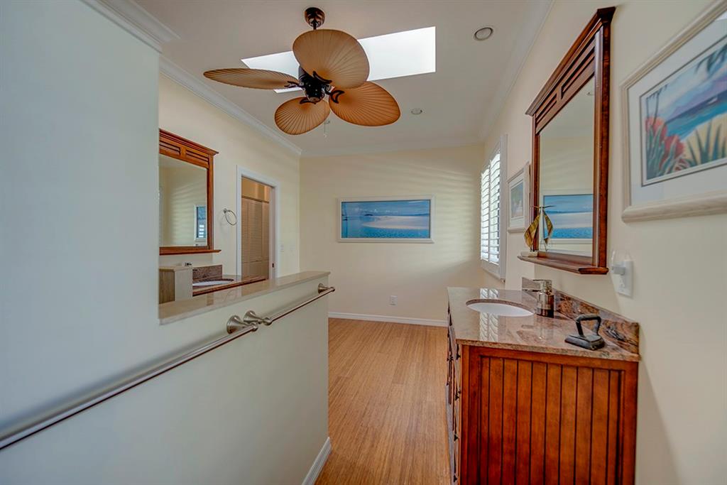 107 South Sewalls Point Road Stuart, FL 34996 - Photo 38 of 57 a bathroom with a sink and a mirror