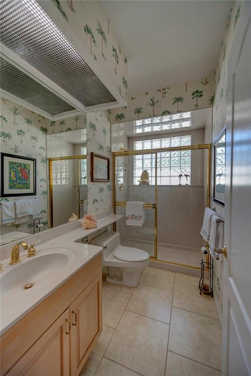 107 South Sewalls Point Road Stuart, FL 34996 - Photo 42 of 57 a spacious bathroom with a granite countertop sink a toilet and shower