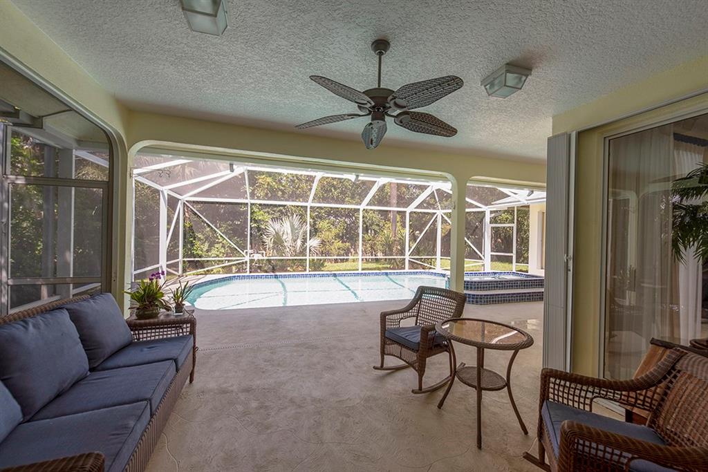 107 South Sewalls Point Road Stuart, FL 34996 - Photo 44 of 57 a living room with furniture and a floor to ceiling window