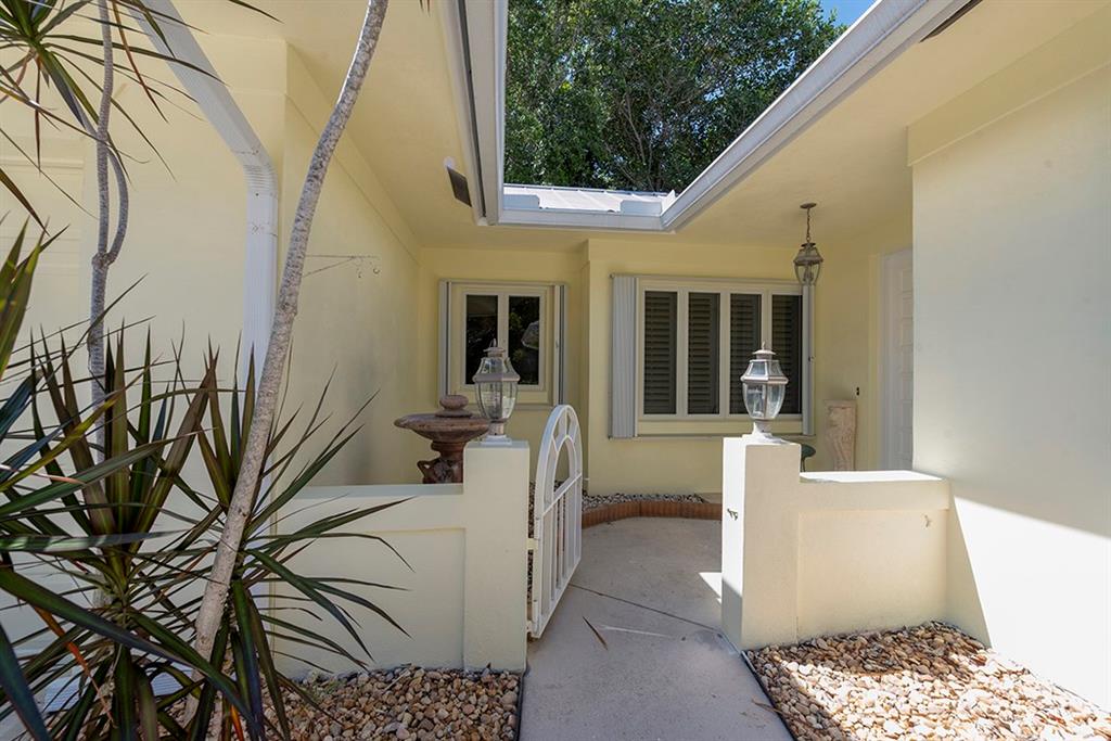 107 South Sewalls Point Road Stuart, FL 34996 - Photo 5 of 57 a view of a patio with couches and table and chairs and potted plants