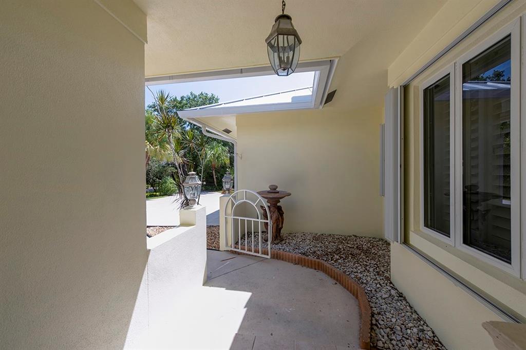 107 South Sewalls Point Road Stuart, FL 34996 - Photo 8 of 57 a bedroom with a bed and a window