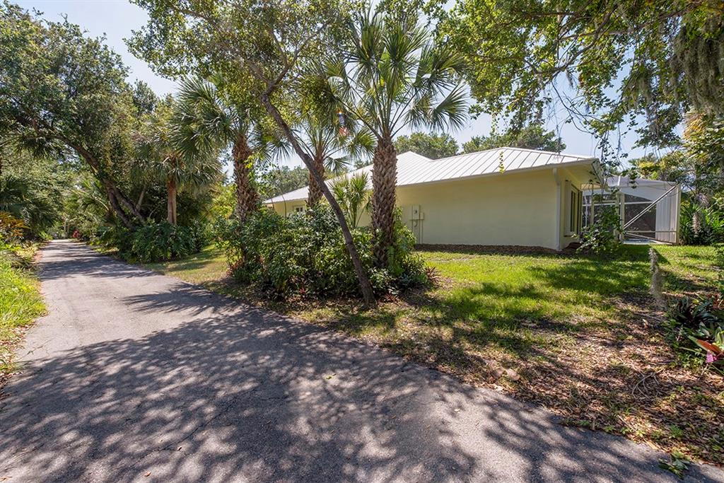 107 South Sewalls Point Road Stuart, FL 34996 - Photo 10 of 57 a view of a yard with plants and large trees
