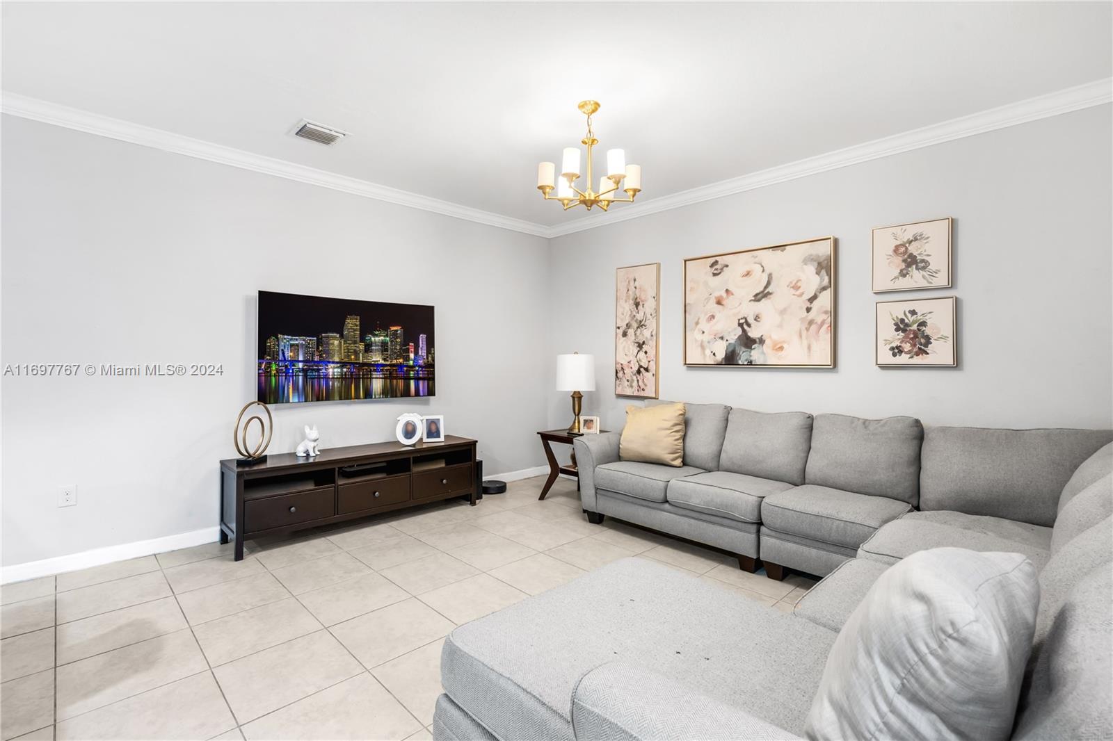 17403 Southwest 155th Court Miami, FL 33187 - Photo 13 of 42 a living room with furniture and a couch