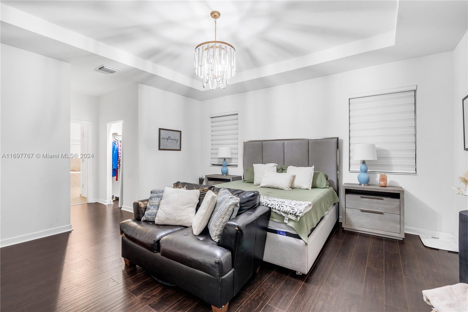 17403 Southwest 155th Court Miami, FL 33187 - Photo 15 of 42 a living room with furniture and a chandelier