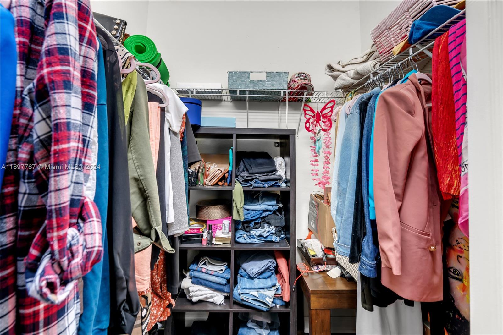 17403 Southwest 155th Court Miami, FL 33187 - Photo 17 of 42 a view of walk in closet with clothes and shoes