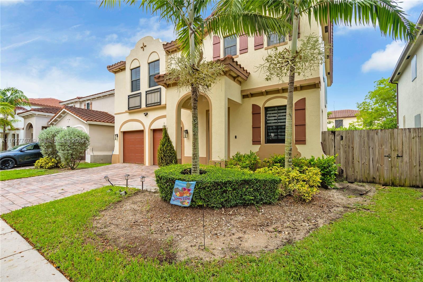 17403 Southwest 155th Court Miami, FL 33187 - Photo 2 of 42 front view of a house with a yard and potted plants