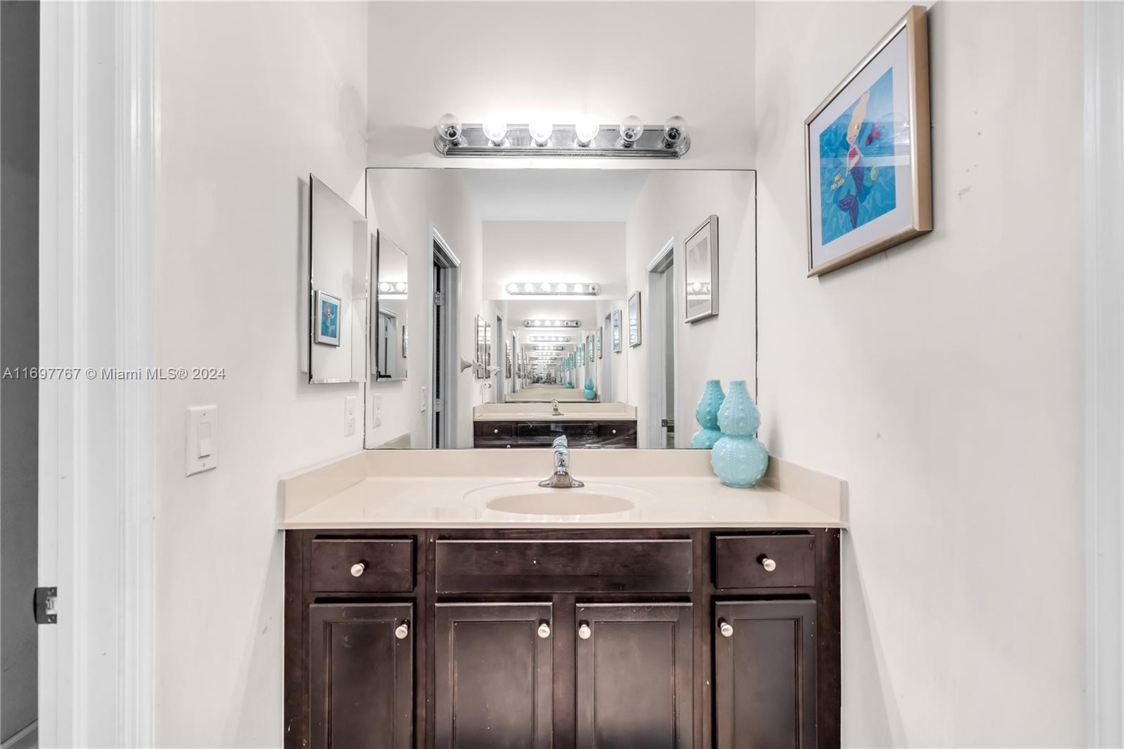 17403 Southwest 155th Court Miami, FL 33187 - Photo 26 of 42 a bathroom with a granite countertop sink a mirror and a