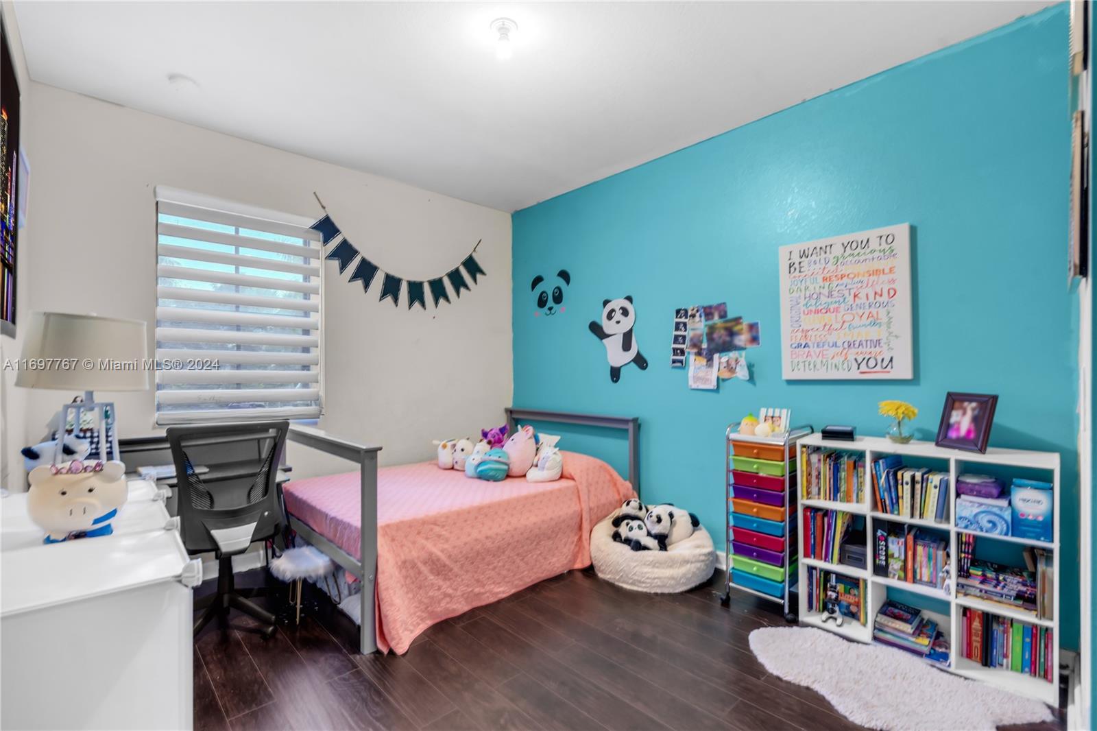 17403 Southwest 155th Court Miami, FL 33187 - Photo 27 of 42 a bedroom with furniture toys and a wooden floor
