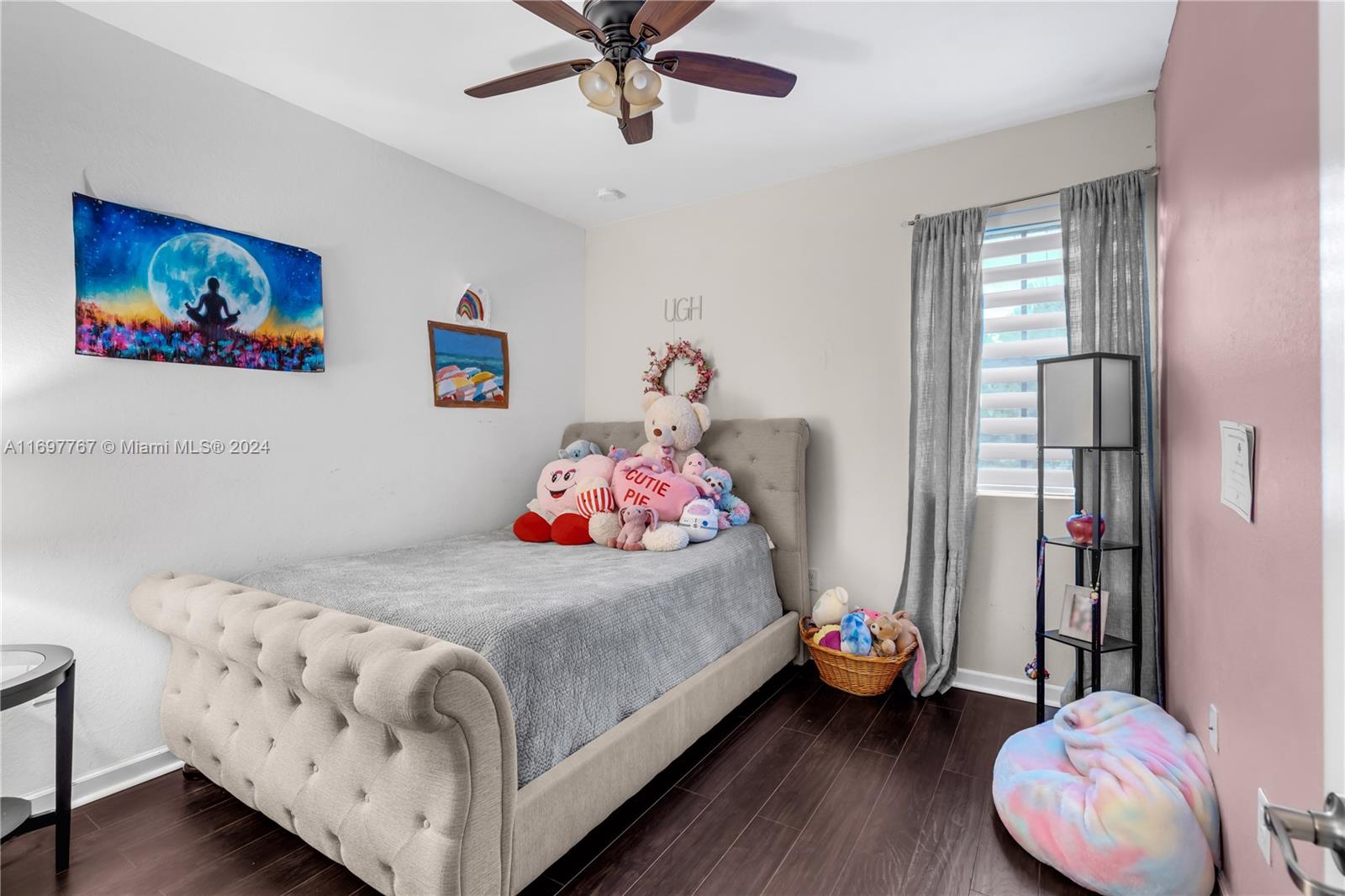 17403 Southwest 155th Court Miami, FL 33187 - Photo 29 of 42 a bedroom with a bed and a chandelier