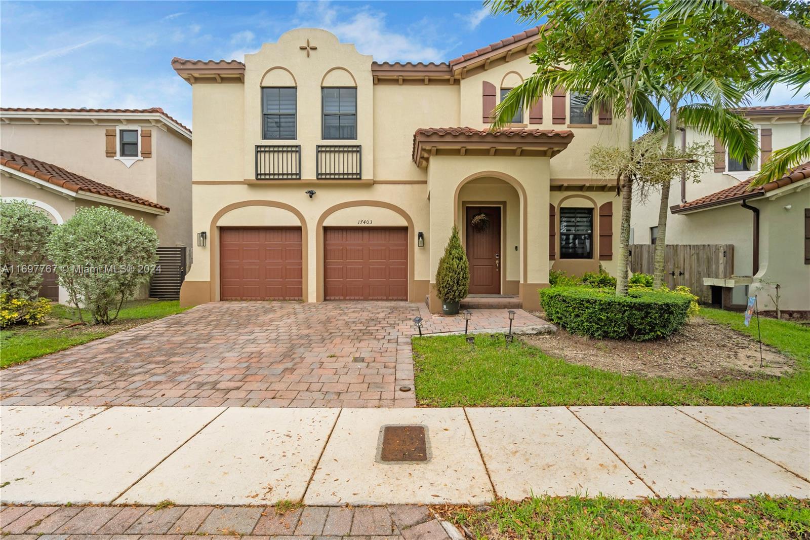 17403 Southwest 155th Court Miami, FL 33187 - Photo 3 of 42 a front view of a house with garden