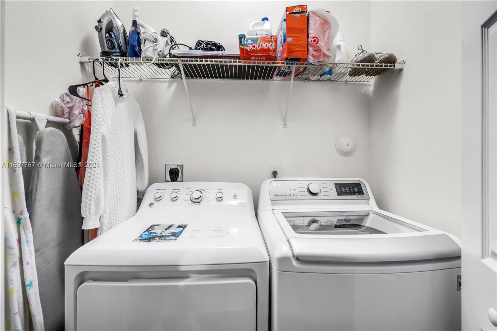 17403 Southwest 155th Court Miami, FL 33187 - Photo 31 of 42 a utility room with dryer and washer