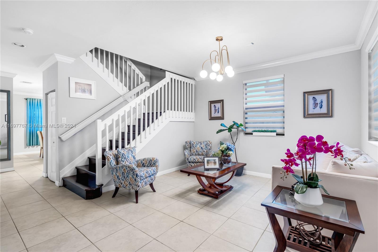 17403 Southwest 155th Court Miami, FL 33187 - Photo 5 of 42 a view of hall way with furniture and toys
