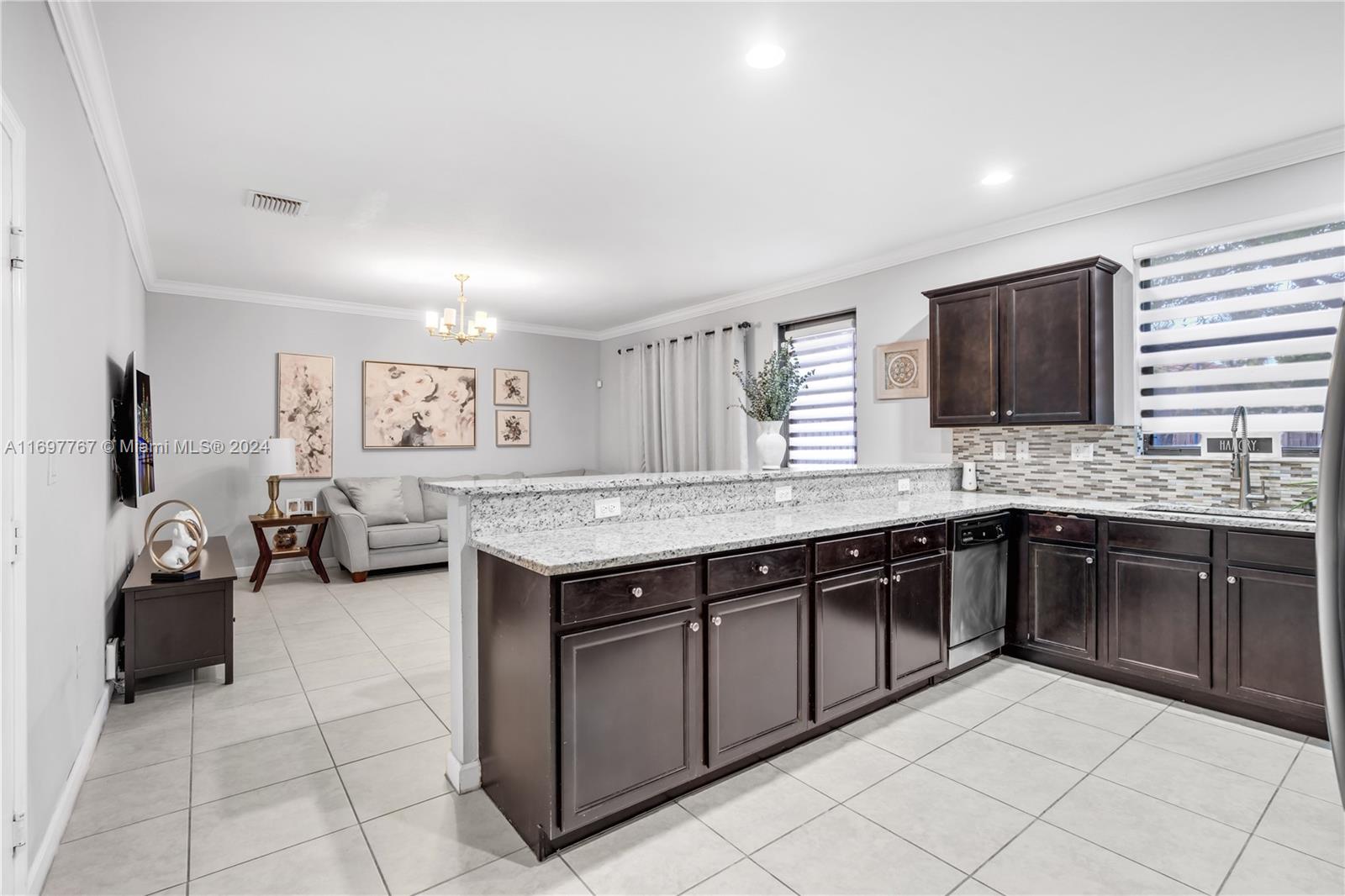 17403 Southwest 155th Court Miami, FL 33187 - Photo 9 of 42 a kitchen with a sink and cabinets