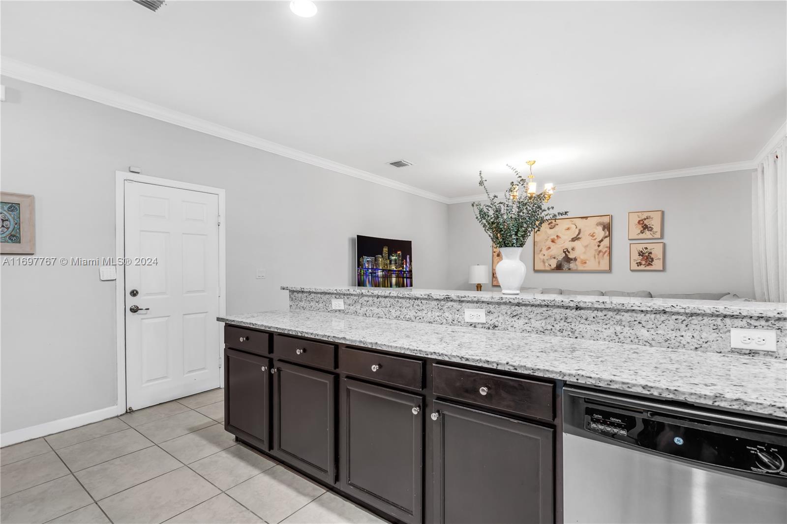 17403 Southwest 155th Court Miami, FL 33187 - Photo 10 of 42 a bathroom with a granite countertop sink and a mirror