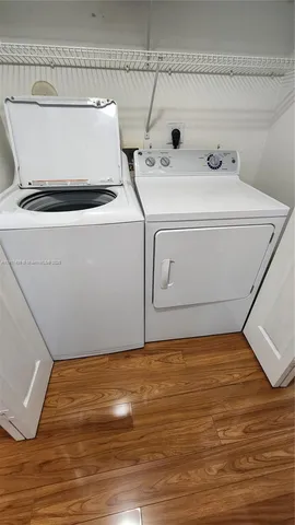 a utility room with washer and dryer
