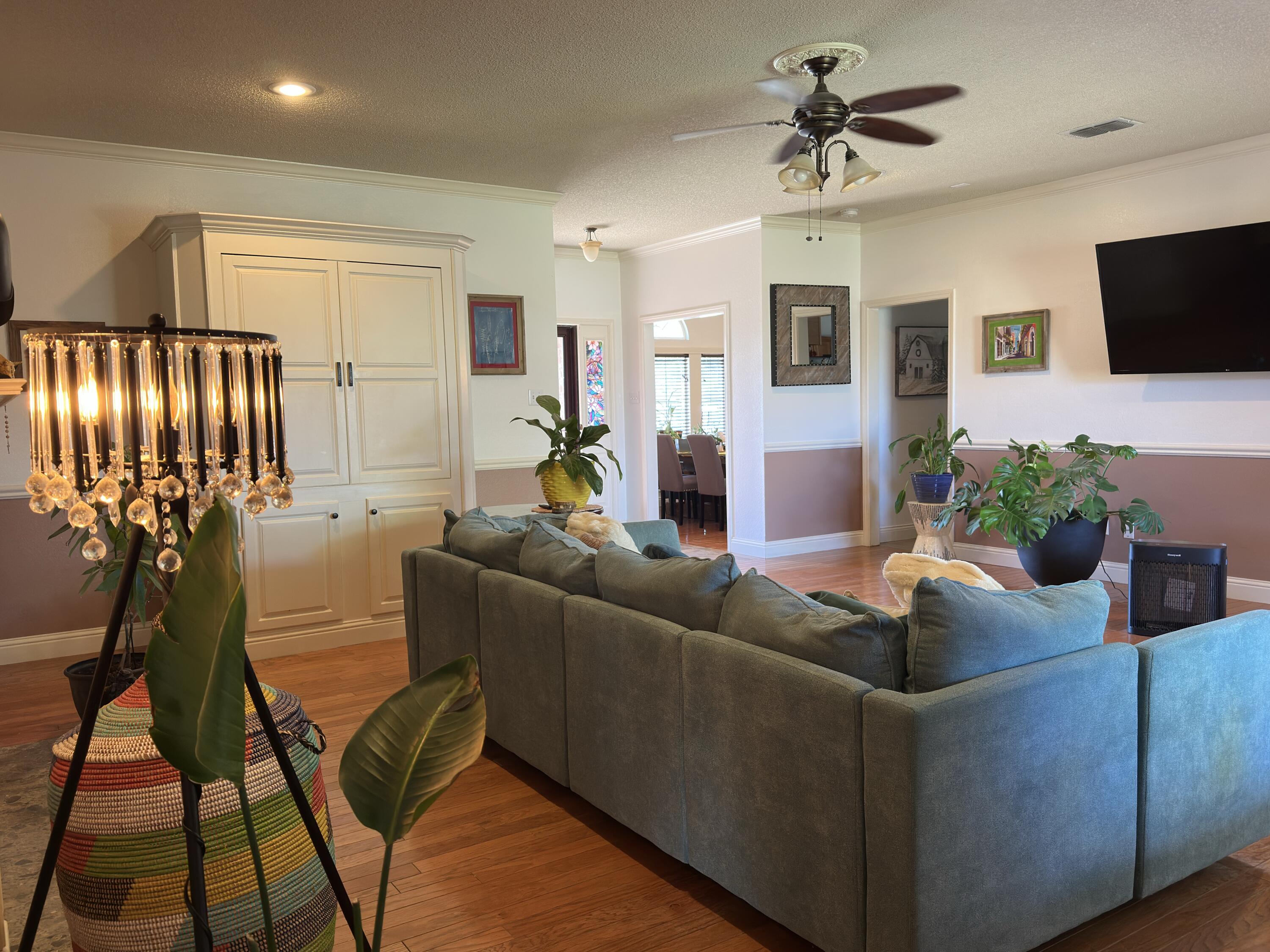 4902 103rd Street Lubbock, TX 79424 - Photo 11 of 23 a living room with furniture and a flat screen tv