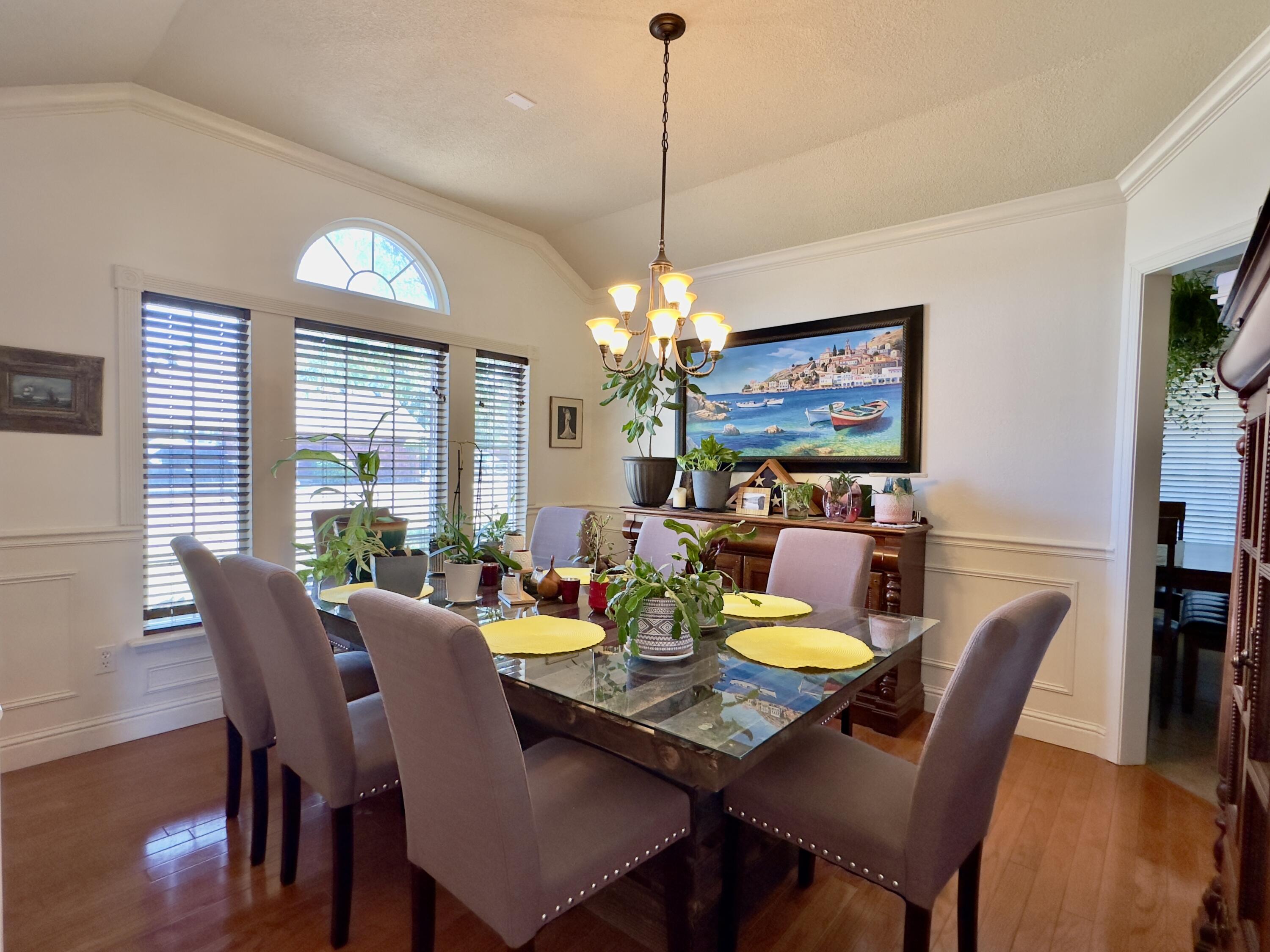 4902 103rd Street Lubbock, TX 79424 - Photo 2 of 23 a view of a dining room with furniture window and wooden floor