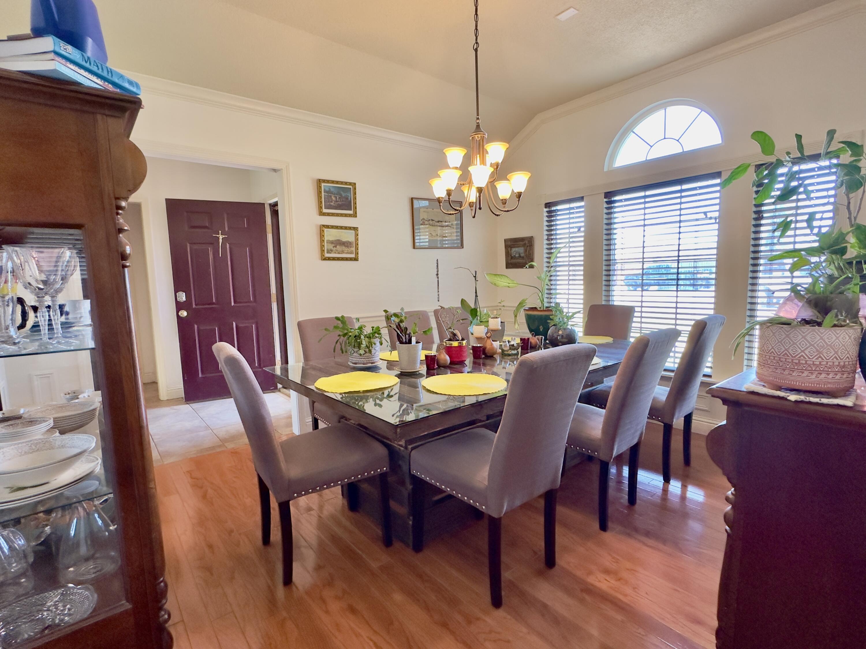 4902 103rd Street Lubbock, TX 79424 - Photo 3 of 23 a view of a dining room with furniture window and wooden floor
