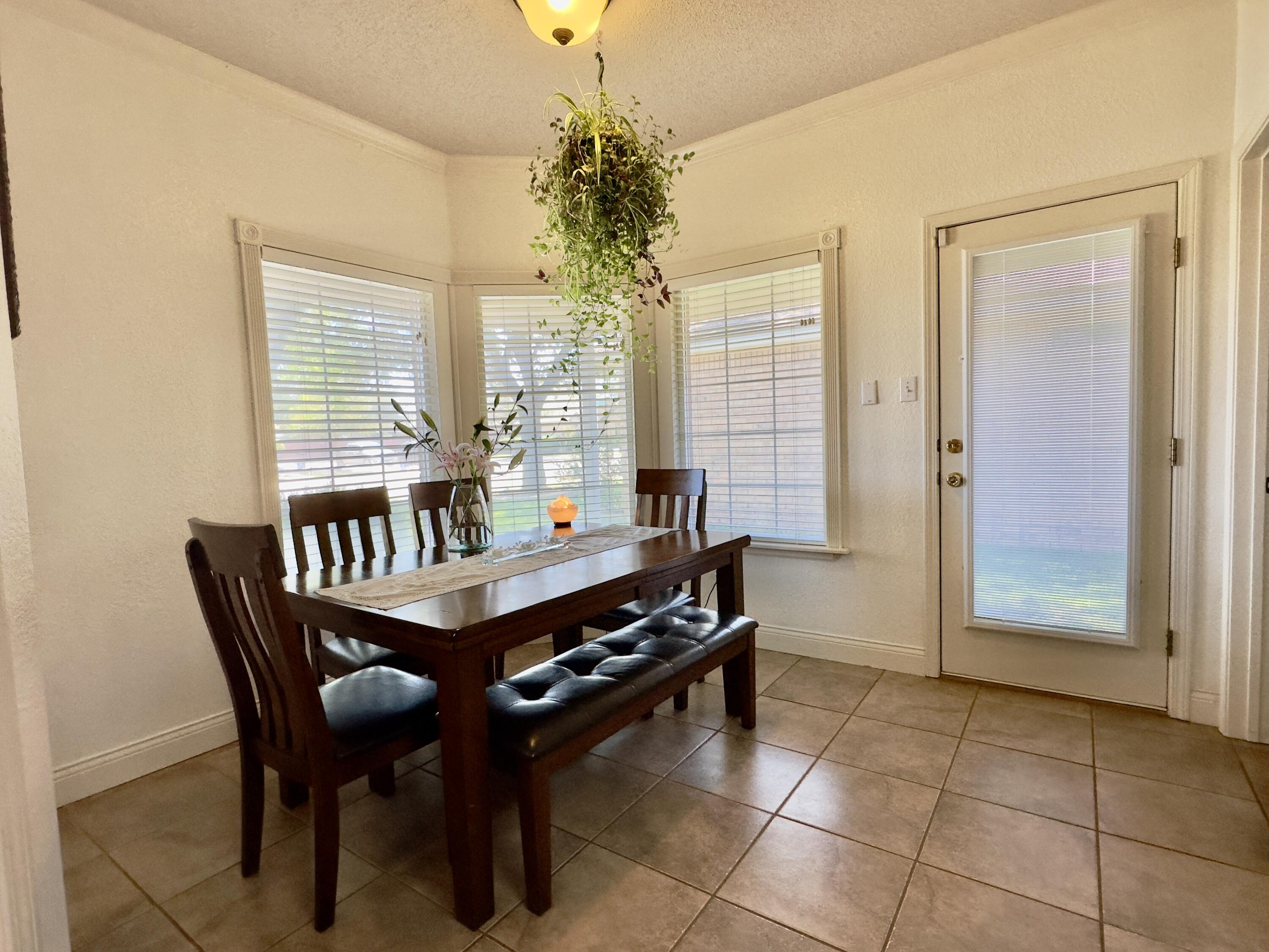 4902 103rd Street Lubbock, TX 79424 - Photo 4 of 23 a dining room with furniture and window