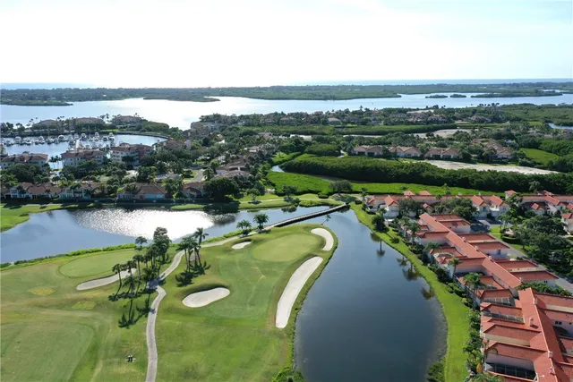 an aerial view of a residential houses with outdoor space