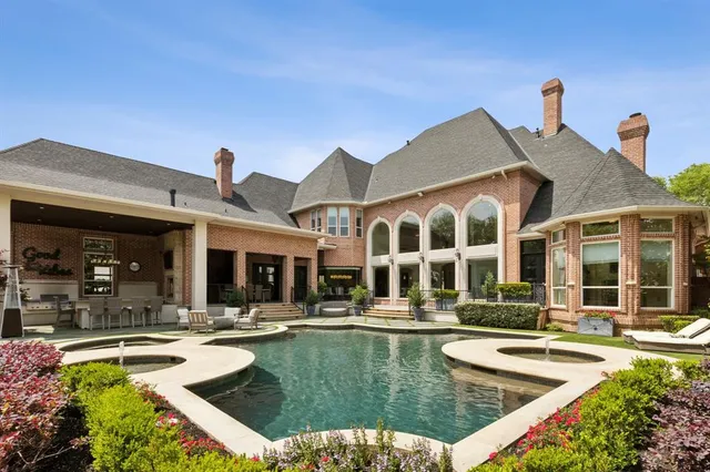 a view of a patio with swimming pool table and chairs