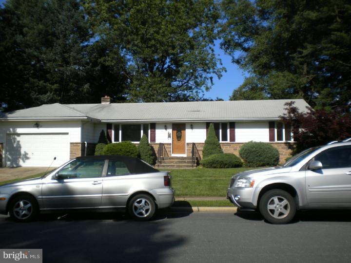 32 Cold Spring Road Mercerville, NJ 08619 - Photo 1 of 16 a front view of a house with parking space