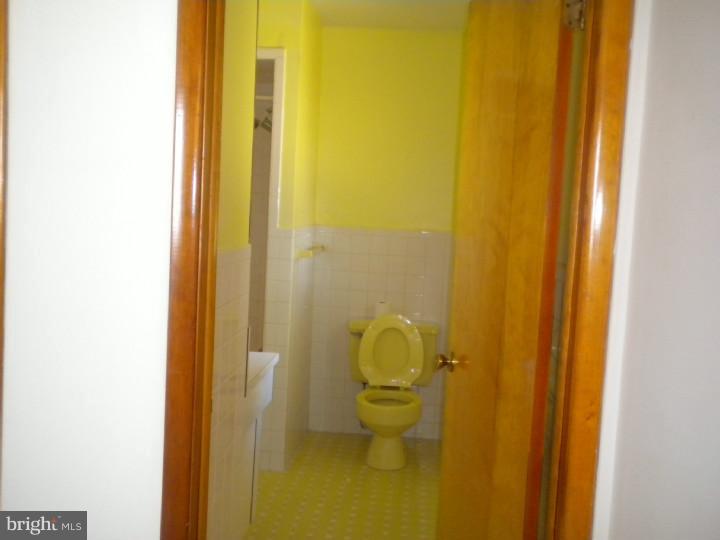 32 Cold Spring Road Mercerville, NJ 08619 - Photo 13 of 16 a bathroom with a granite countertop sink and a toilet