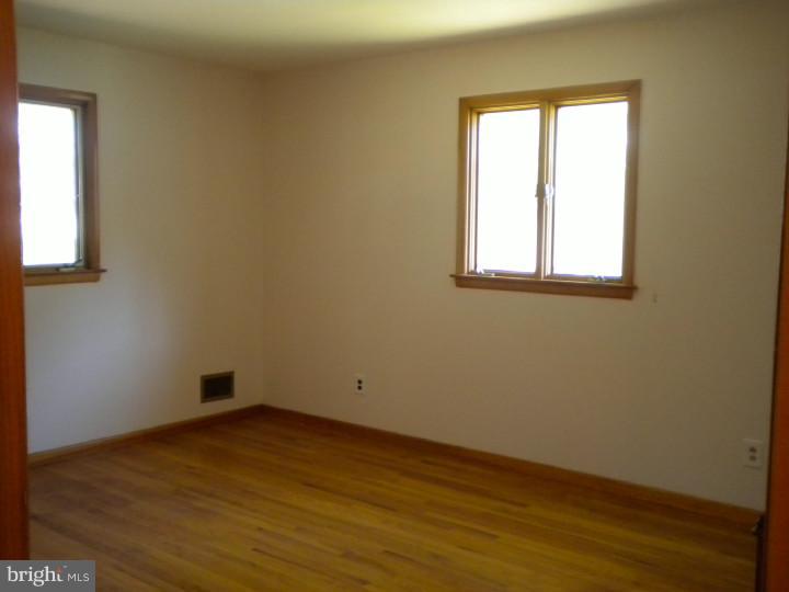 32 Cold Spring Road Mercerville, NJ 08619 - Photo 14 of 16 an empty room with wooden floor and windows