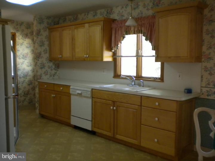 32 Cold Spring Road Mercerville, NJ 08619 - Photo 5 of 16 a room with a sink window and cabinets