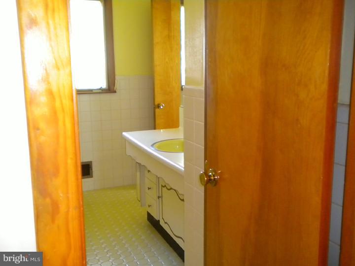 32 Cold Spring Road Mercerville, NJ 08619 - Photo 9 of 16 a bathroom with a sink