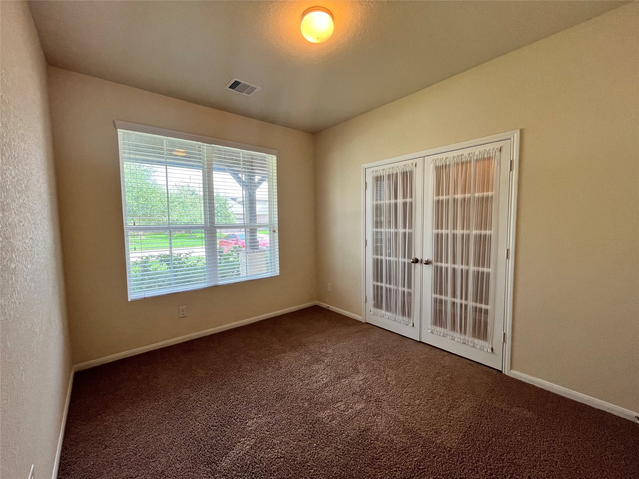 15103 Signal Ridge Way Cypress, TX 77429 - Photo 13 of 38 an empty room with windows and yard