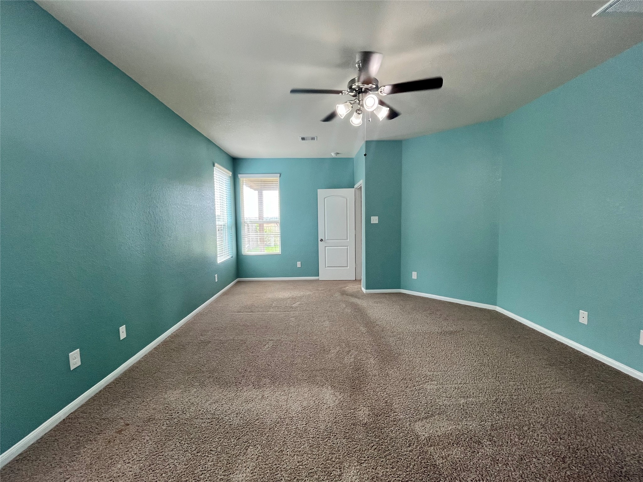 15103 Signal Ridge Way Cypress, TX 77429 - Photo 15 of 38 a view of an empty room with window and chandelier fan