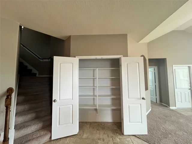 a view of an empty walk in closet