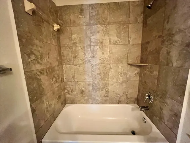 a bathroom with a bath tub