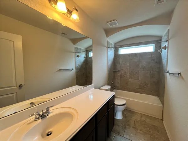a view of a storage and utility room with a washer dryer